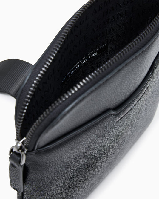 Textured crossbody bag with a zipper and adjustable strap