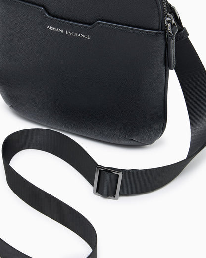 Textured crossbody bag with a zipper and adjustable strap
