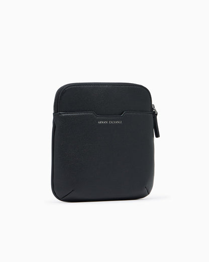 Textured crossbody bag with a zipper and adjustable strap