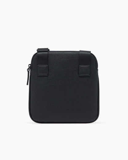 Textured crossbody bag with a zipper and adjustable strap