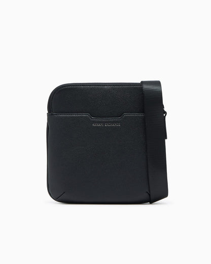 Textured crossbody bag with a zipper and adjustable strap
