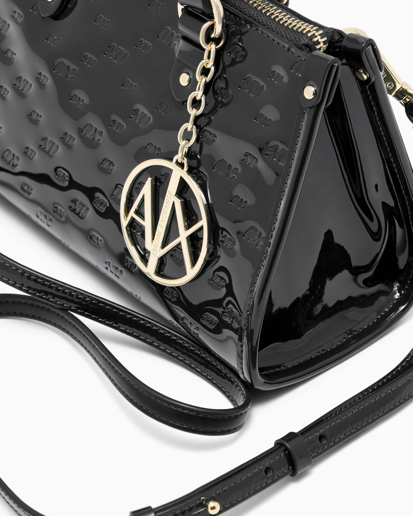 Glossy handbag with embossed pattern and detachable strap
