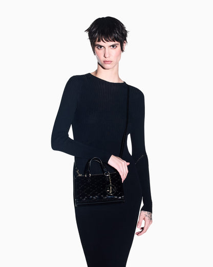 Glossy handbag with embossed pattern and detachable strap