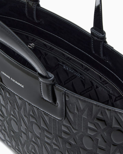 Tote bag with an embossed pattern and a metallic charm