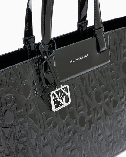 Tote bag with an embossed pattern and a metallic charm