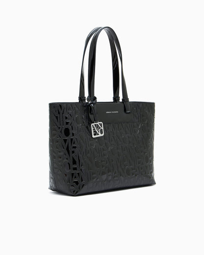 Tote bag with an embossed pattern and a metallic charm