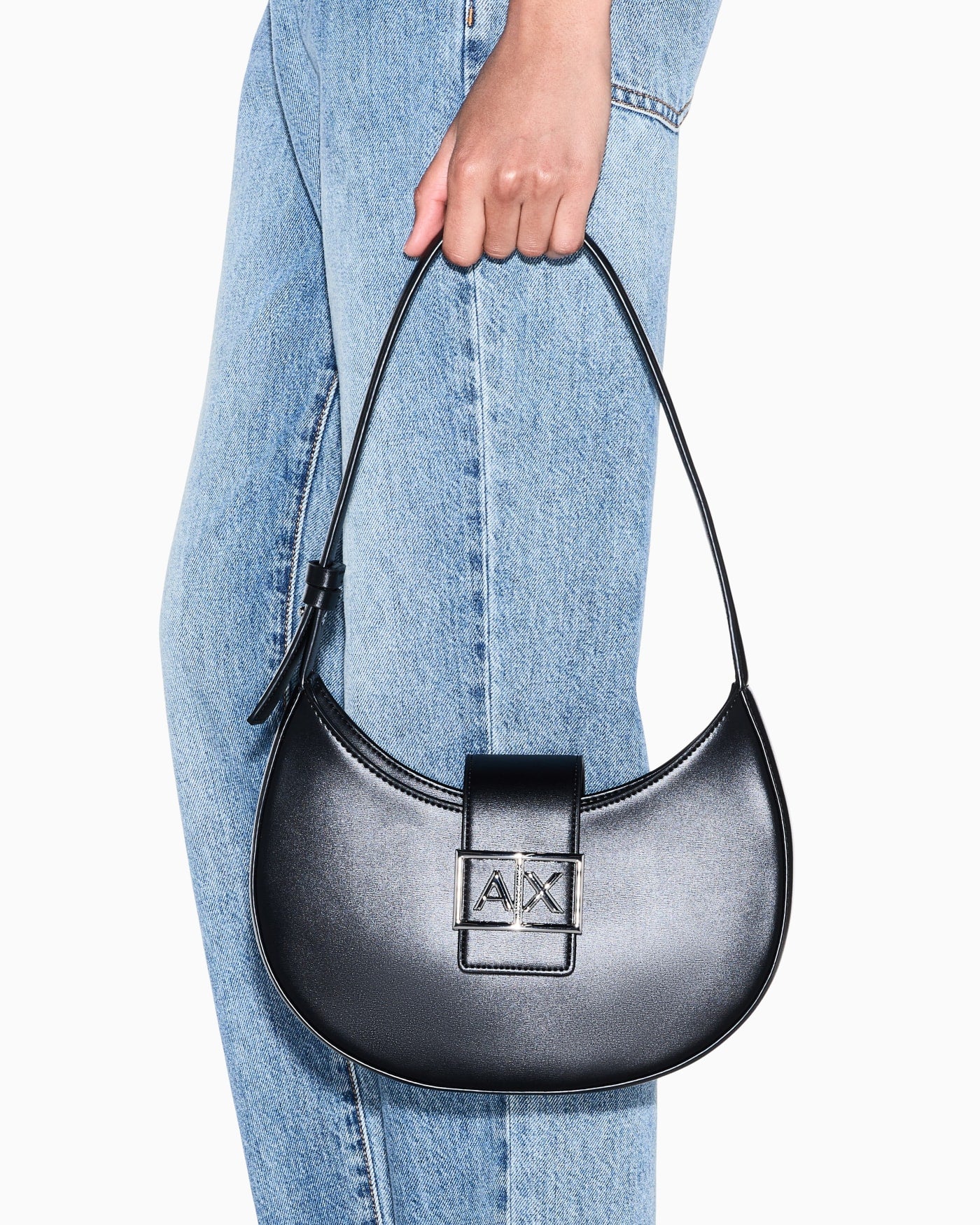 Crescent shoulder bag with a front flap and logo buckle