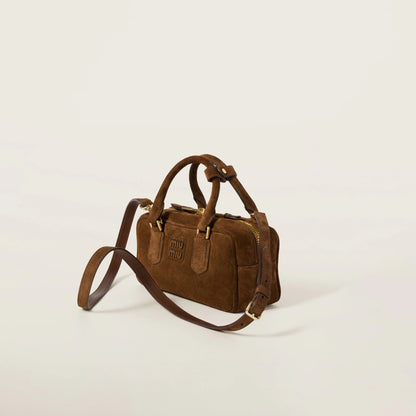 Arcadie padded suede top-handle bag
