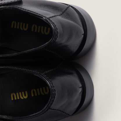 Leather loafers with strap