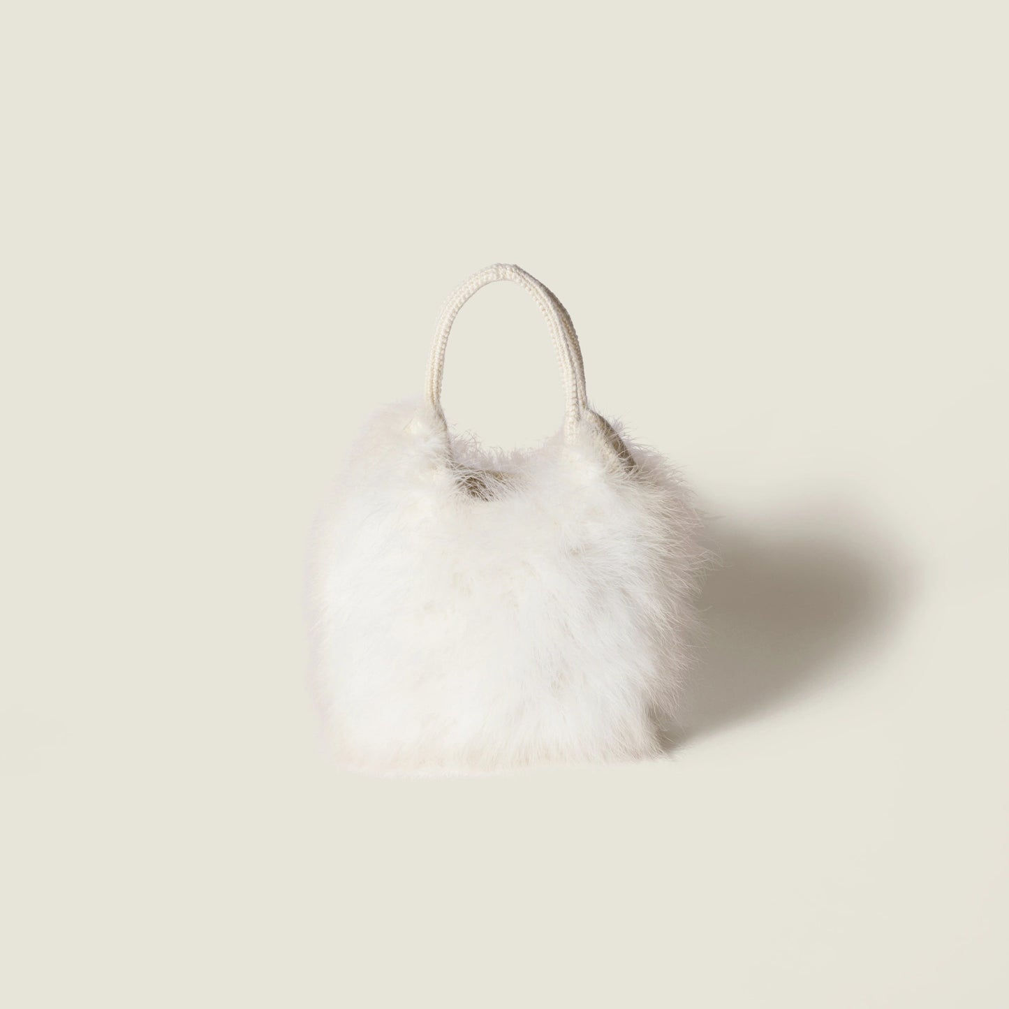 Ivy crochet handbag with feathers