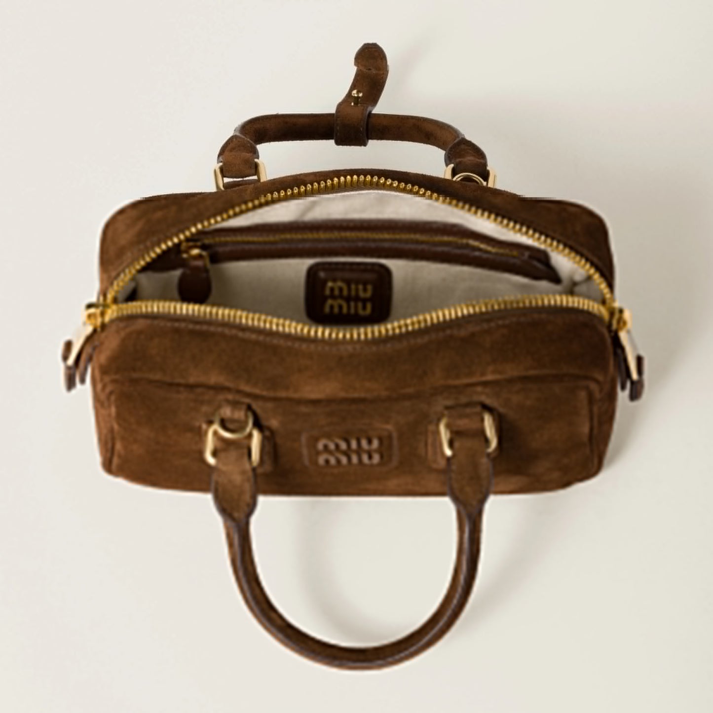 Arcadie padded suede top-handle bag
