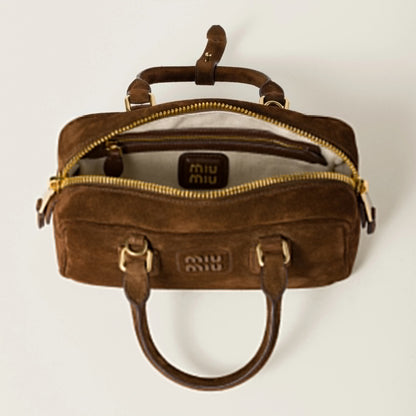Arcadie padded suede top-handle bag