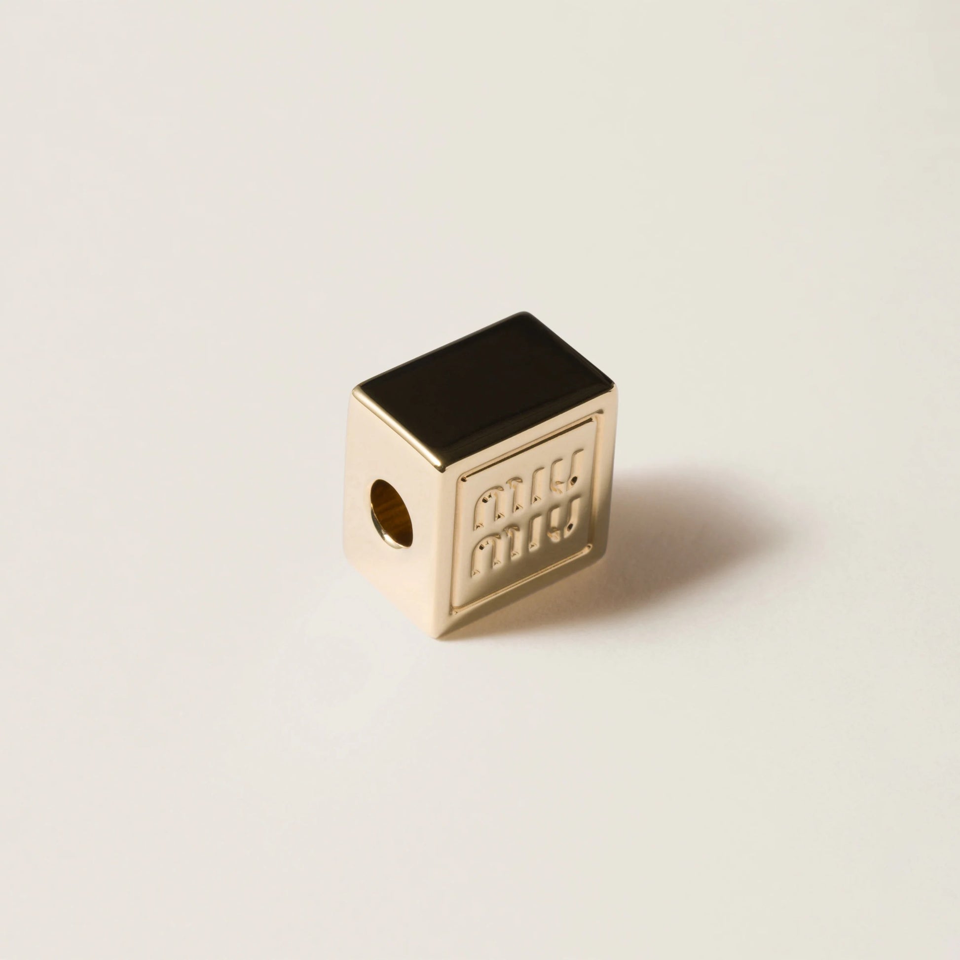 Dice charm with logo