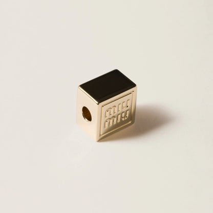 Dice charm with logo
