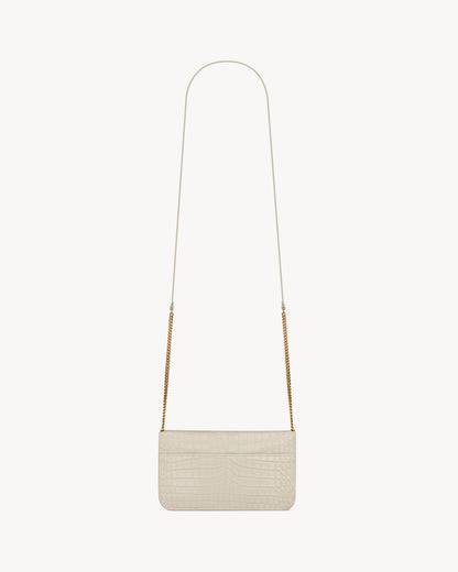 CASSANDRE phone holder in SHINY crocodile-embossed leather