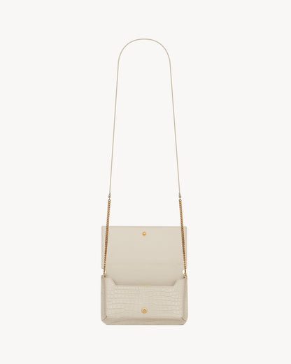 CASSANDRE phone holder in SHINY crocodile-embossed leather
