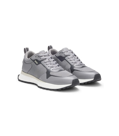 Mixed-material trainers with mesh details and branding