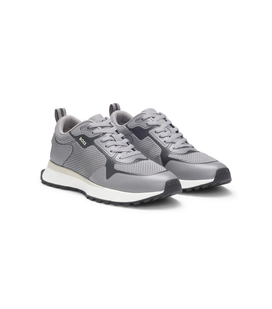 Mixed-material trainers with mesh details and branding