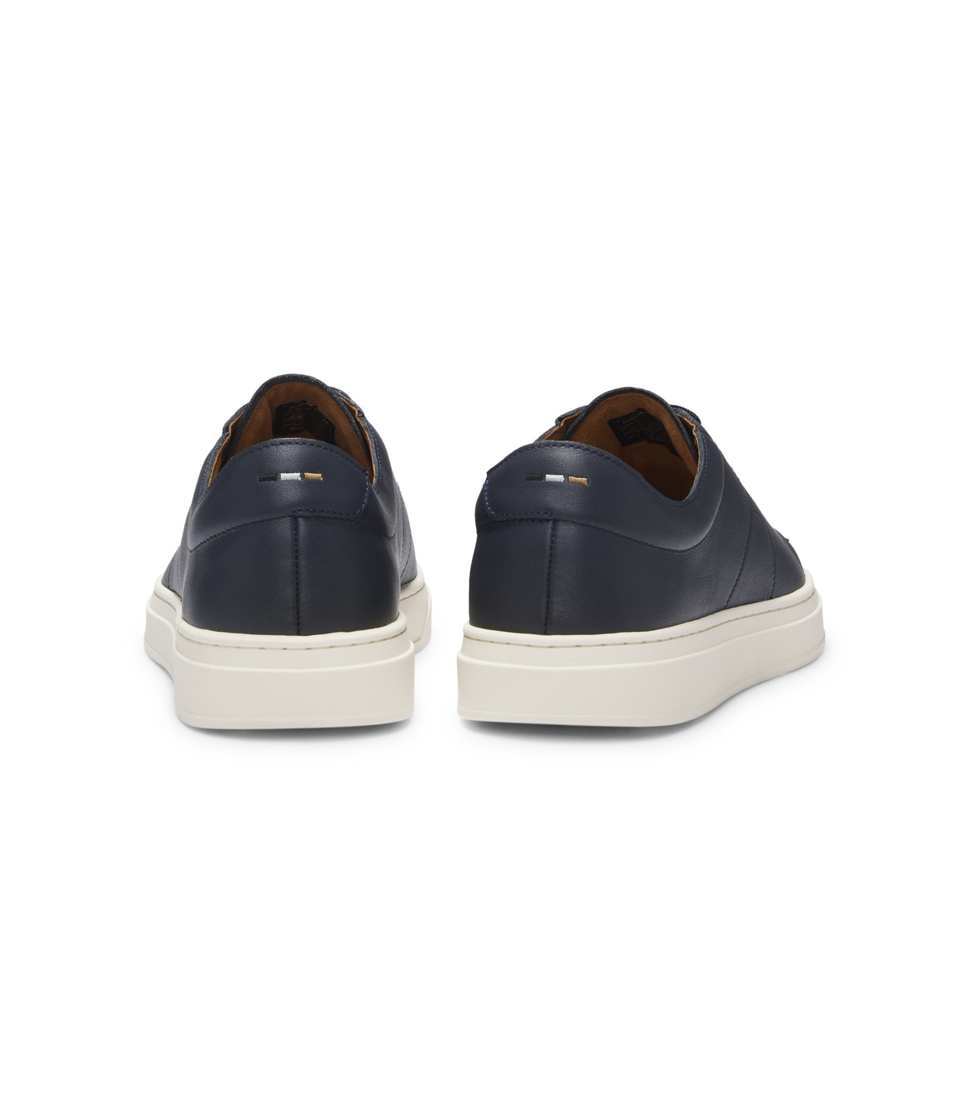 Low-top trainers in leather with embossed logo